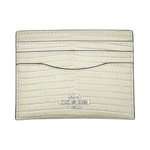 Coach Slim ID Card Case in a pale green, lizard-embossed leather